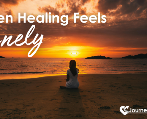 When Healing Feels Lonely woman sitting alone on beach at sunset