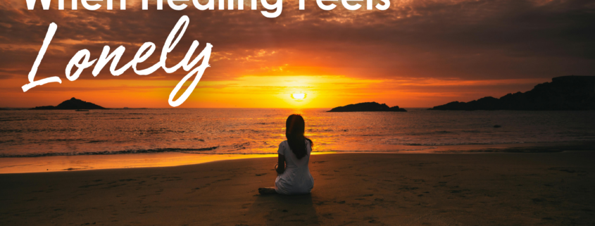 When Healing Feels Lonely woman sitting alone on beach at sunset